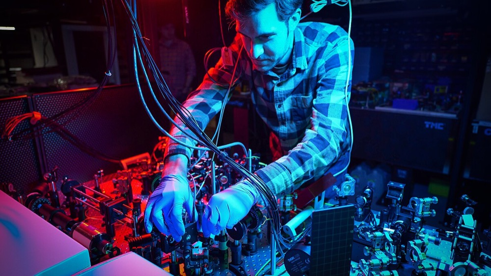 Air Force Research Laboratory scientists working on quantum computing equipment in a research facility